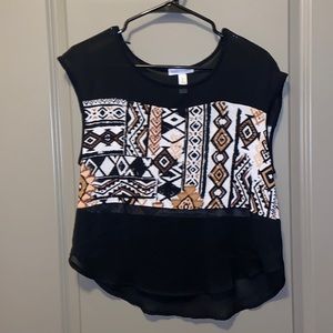 Tribal sleeveless top. The black is see through.